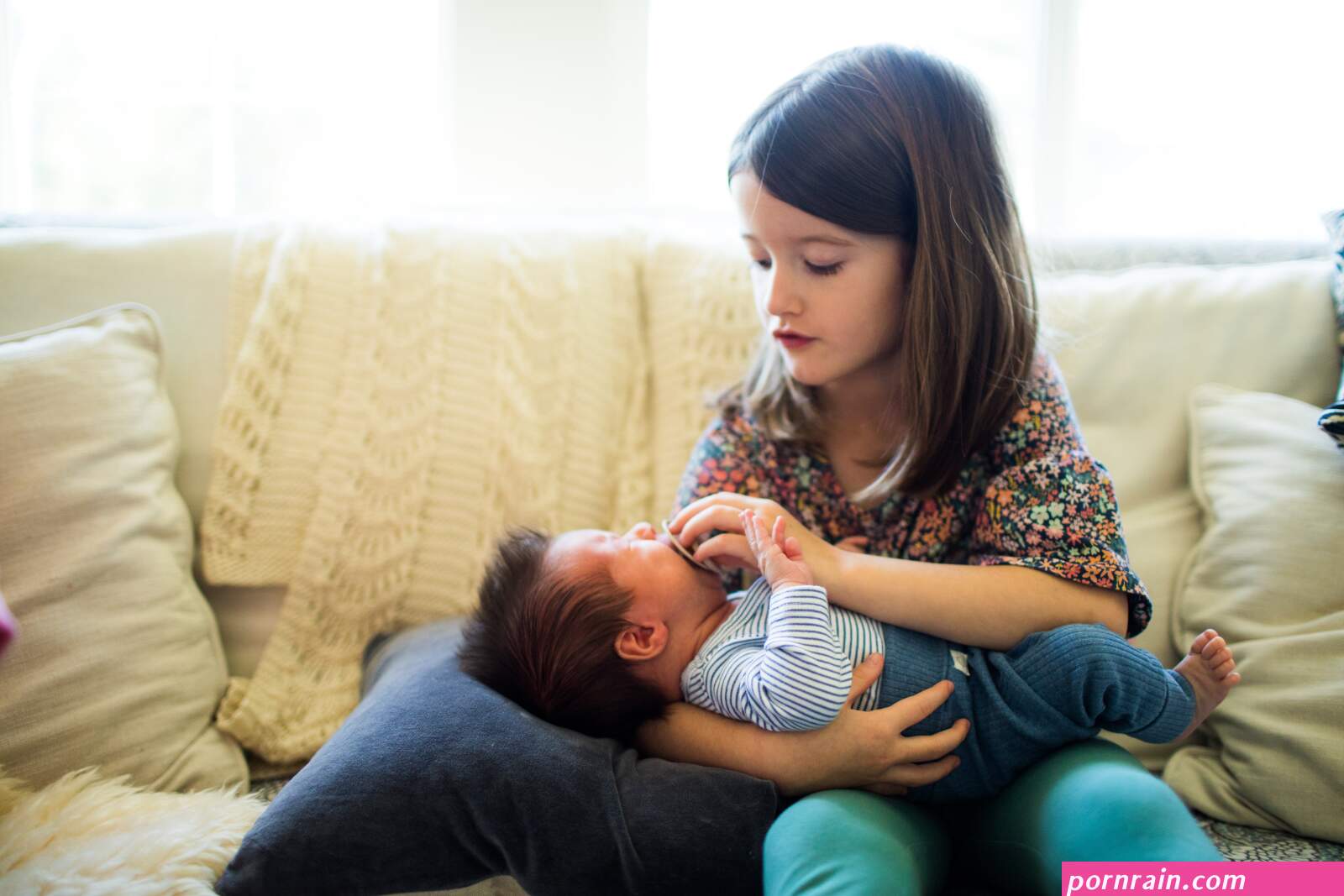 sister sits on brother before mom comes home
