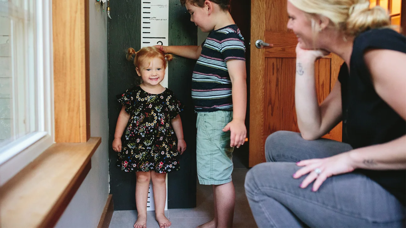sister sits on brother before mom comes home