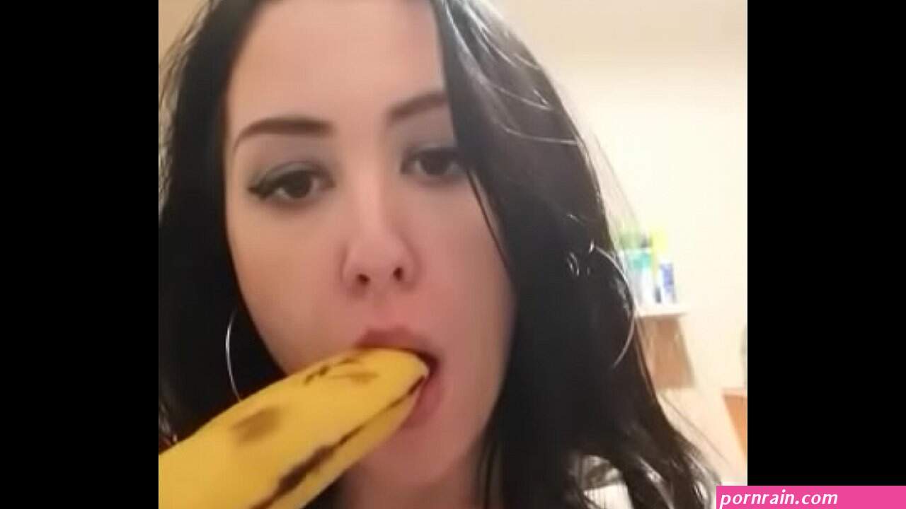 Slut at home practicing deep throat with banana
