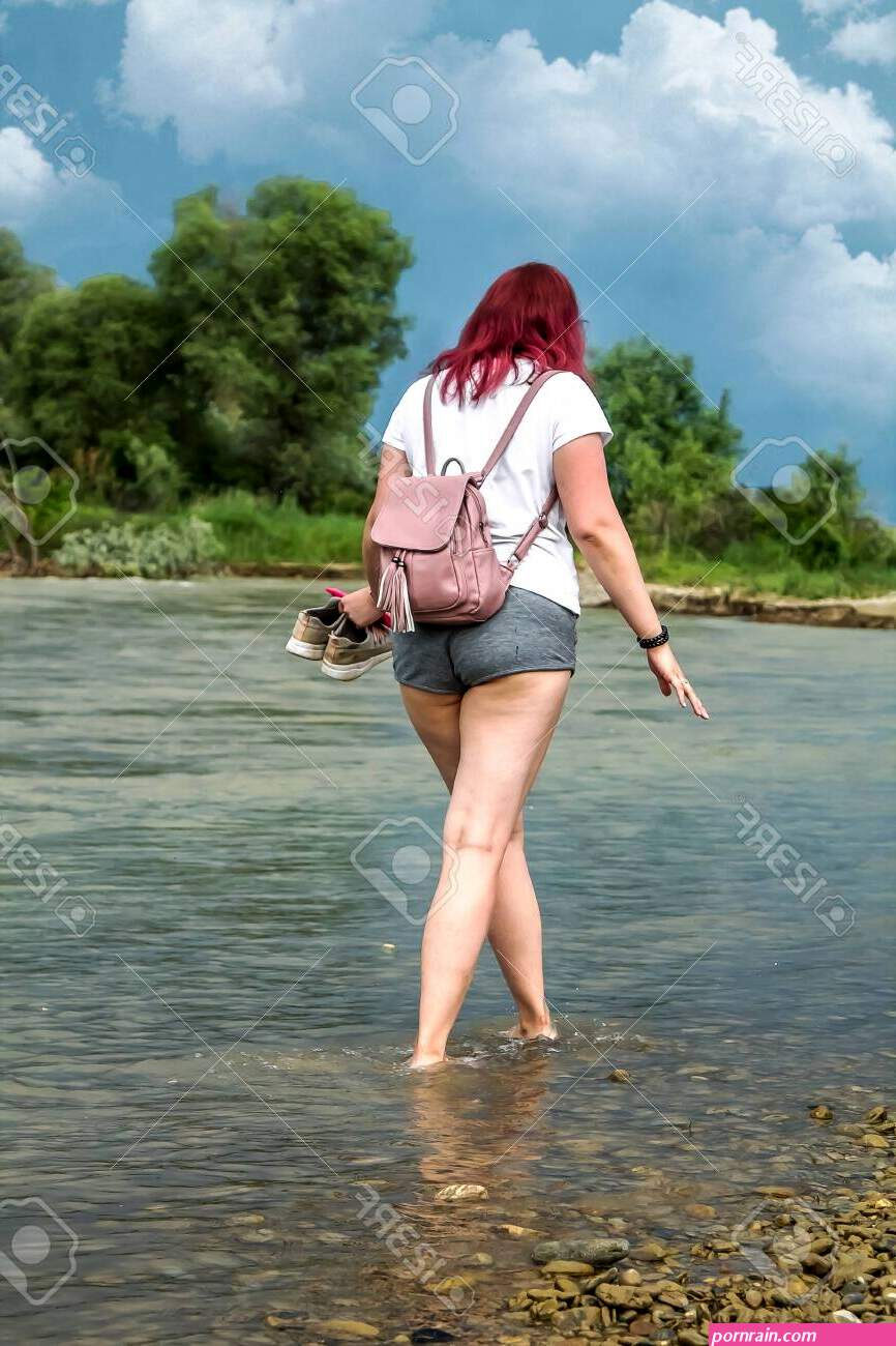 Young Girl In Short Shorts With Big Booty Walks On Water In A River Stock  Photo, Picture And Royalty Free Image. Image 127067988.