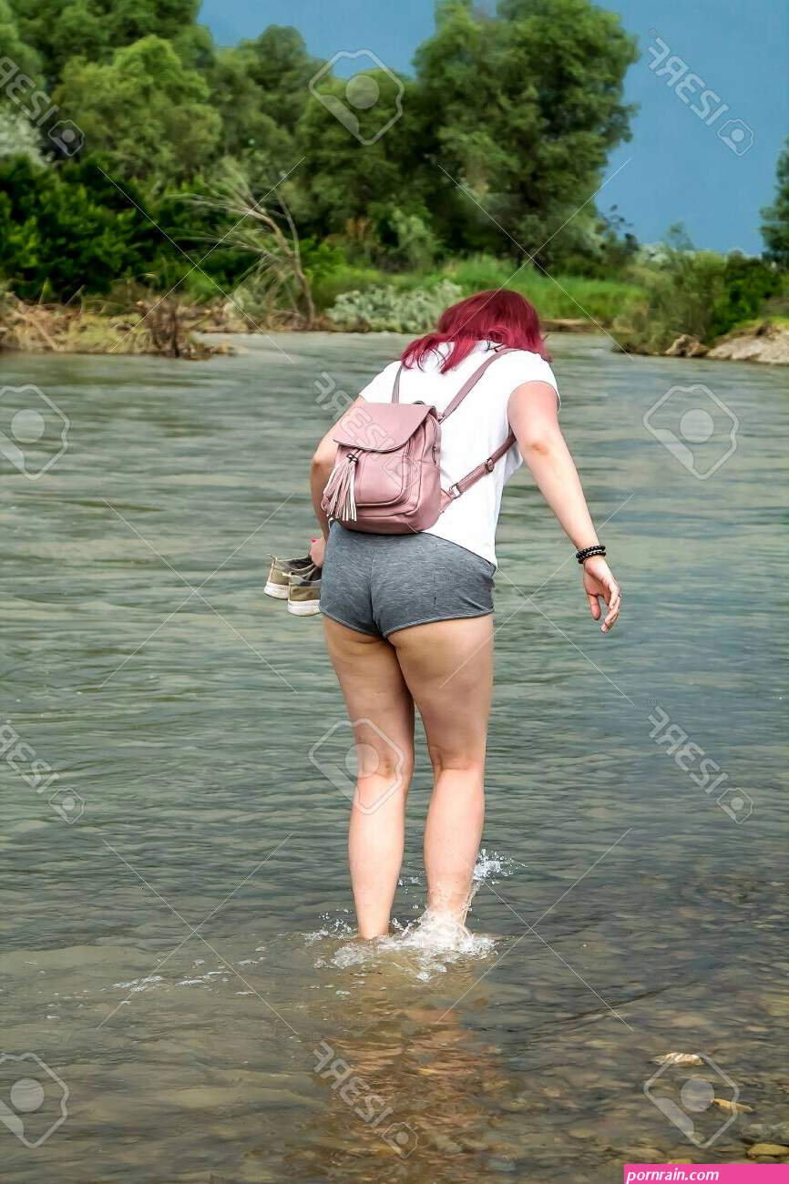 Young Girl In Short Shorts With Big Booty Walks On Water In A River Stock  Photo, Picture And Royalty Free Image. Image 127068498.