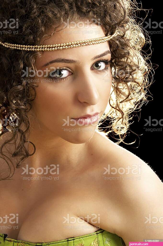 Golden Goddess In Green Corset Stock Photo