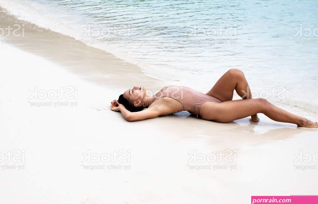 Young Beautiful Woman On The Beach Stock Photo