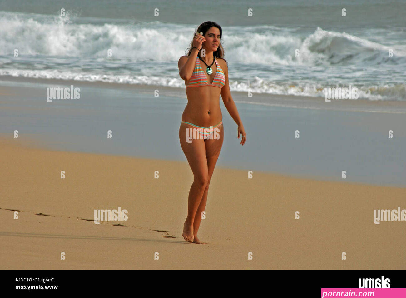 Young lady walking on beach in Hawaii Stock Photo