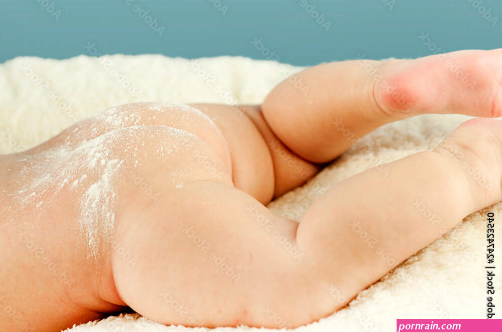 Naked butt of a baby with powdered irritation and prysy at the doctor's  appointment on an isolated blue background. Concept of child Photos | Adobe  Stock