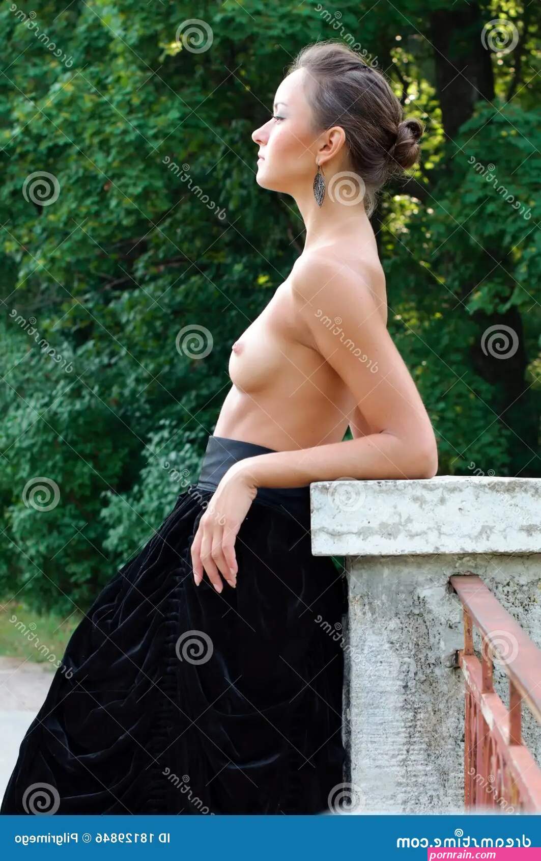 Beautiful Woman with Naked Breast in Summer Garden Stock Photo