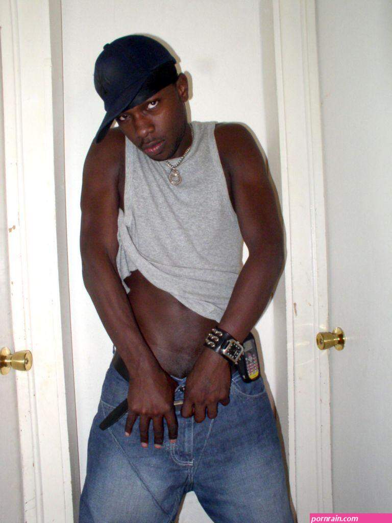 Black gay hunk takes off his shirt and jeans so he could hand pump his hard  dick