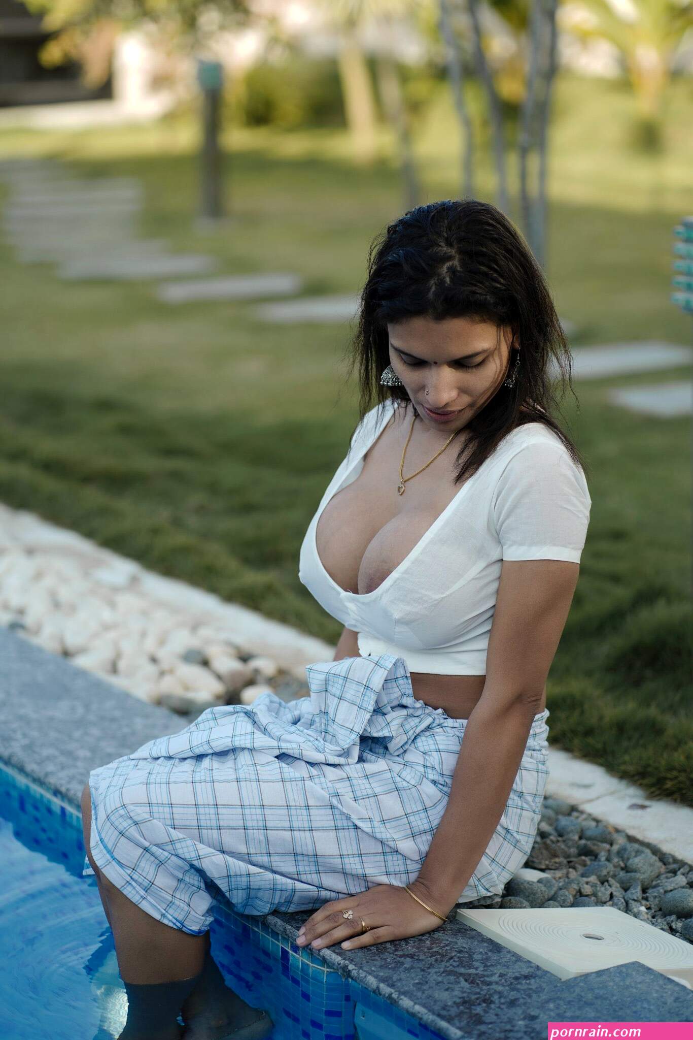 Desi milf Reshmi R Nair posing almost topless in a transparent blouse and showing her nipples