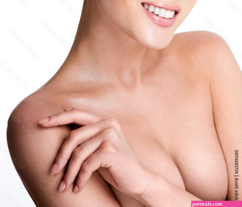 Beautiful young woman with clean skin nude topless breasts. Beautiful woman covering her nude breast. Stock Photo