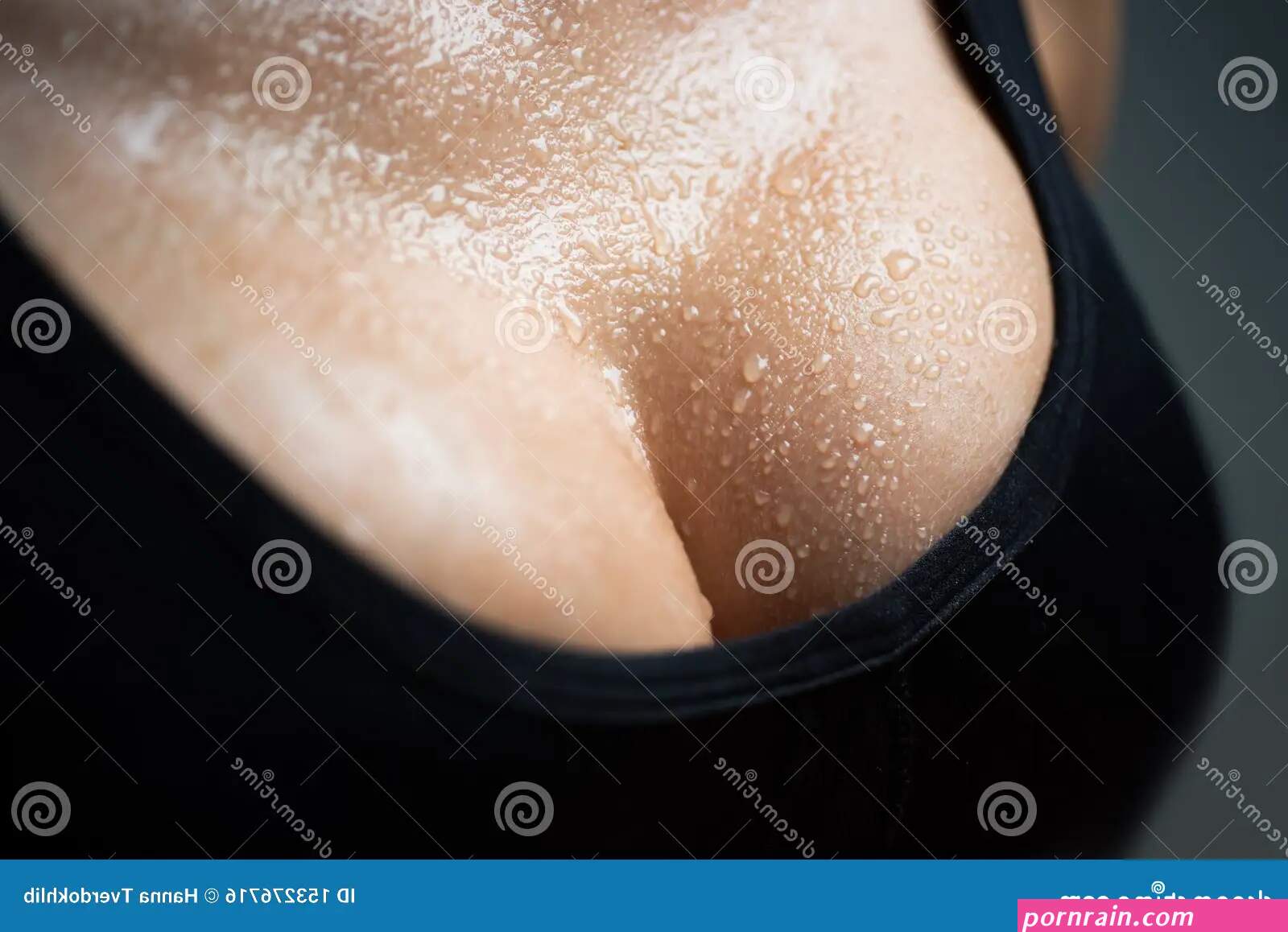 Closeup Portrait of a Female Big Wet Breast. Young Beautiful Girl Shows Her  Gorgeous Breasts. Woman Body. Stock Photo