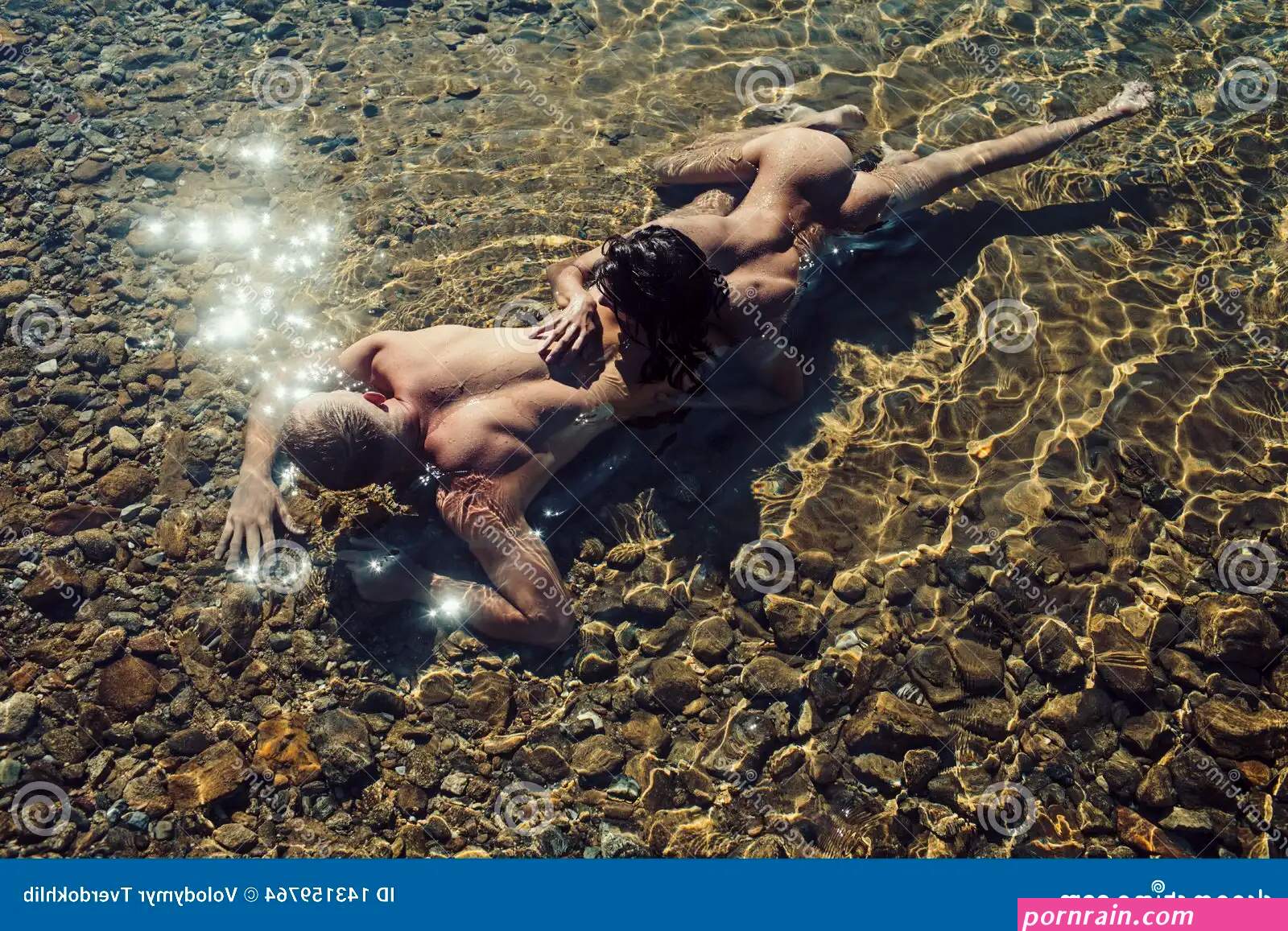 Love Relations of Naked Couple in Sea Water. Summer Holidays and Paradise Travel Vacation Stock Photo