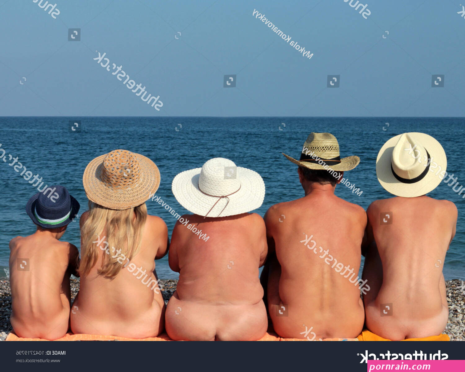 Naked Family Hats Sitting On BeachArkivfotografi1042719796