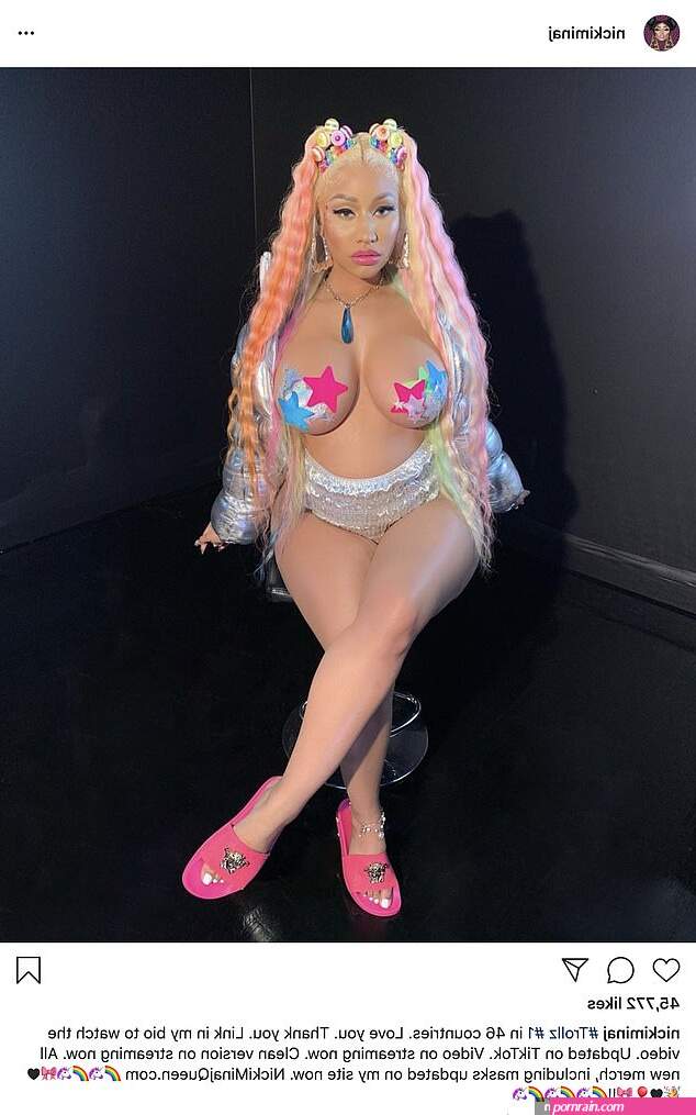 Nicki Minaj fuels pregnancy rumors once again as she posts sultry topless snap with pasties on