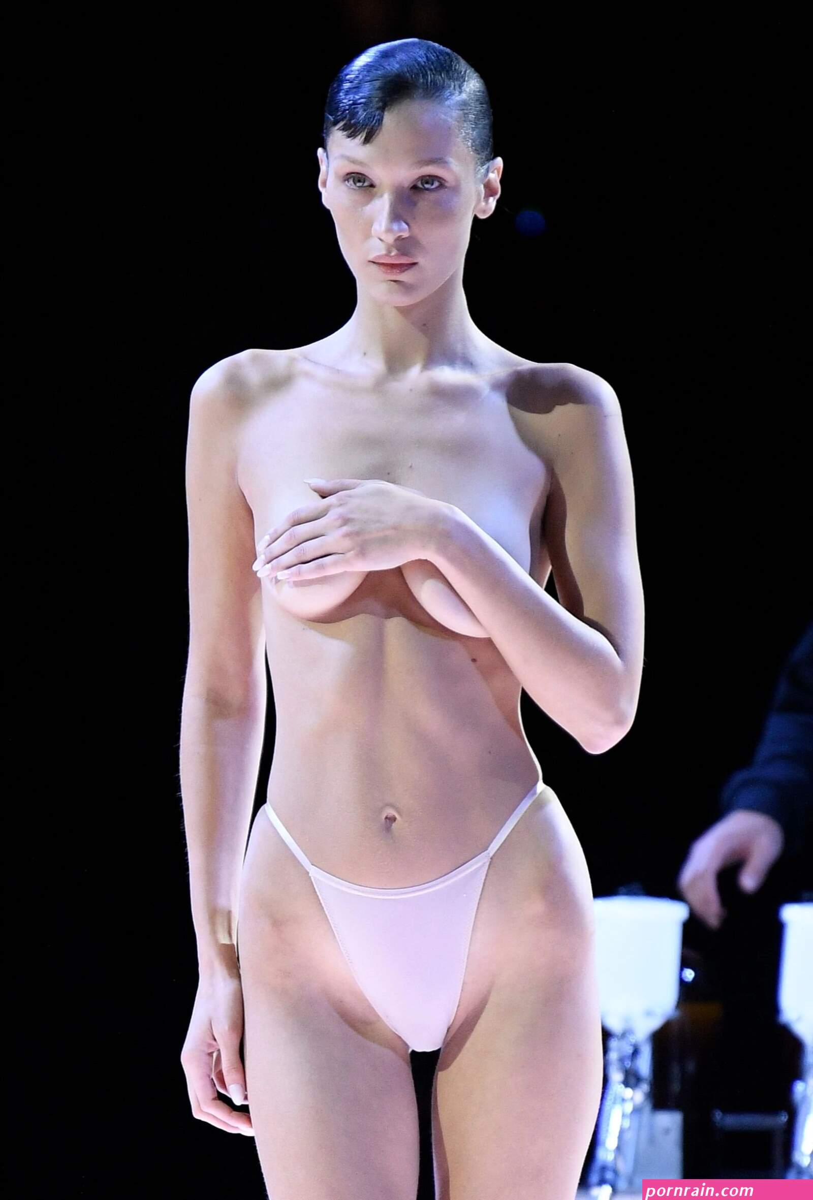 Bella Hadid leaves nothing to the imagination as topless model wears barely-there spray on dress
