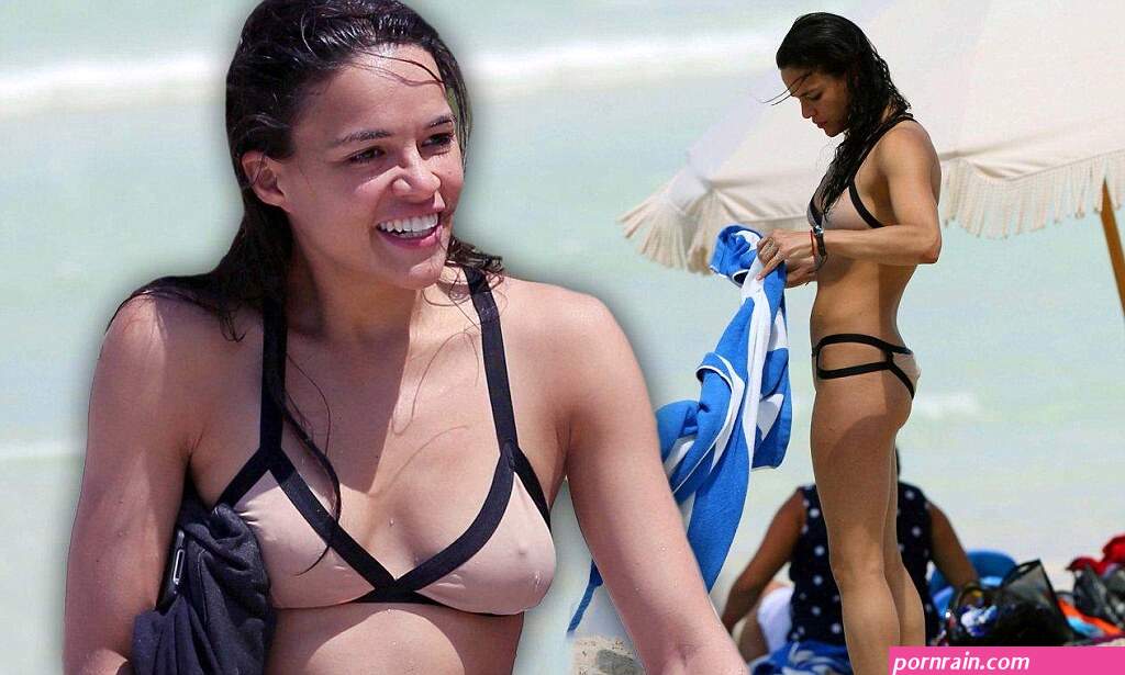 Michelle Rodriguez shows off her toned body in daring nude bikini while enjoying a beer on the beach