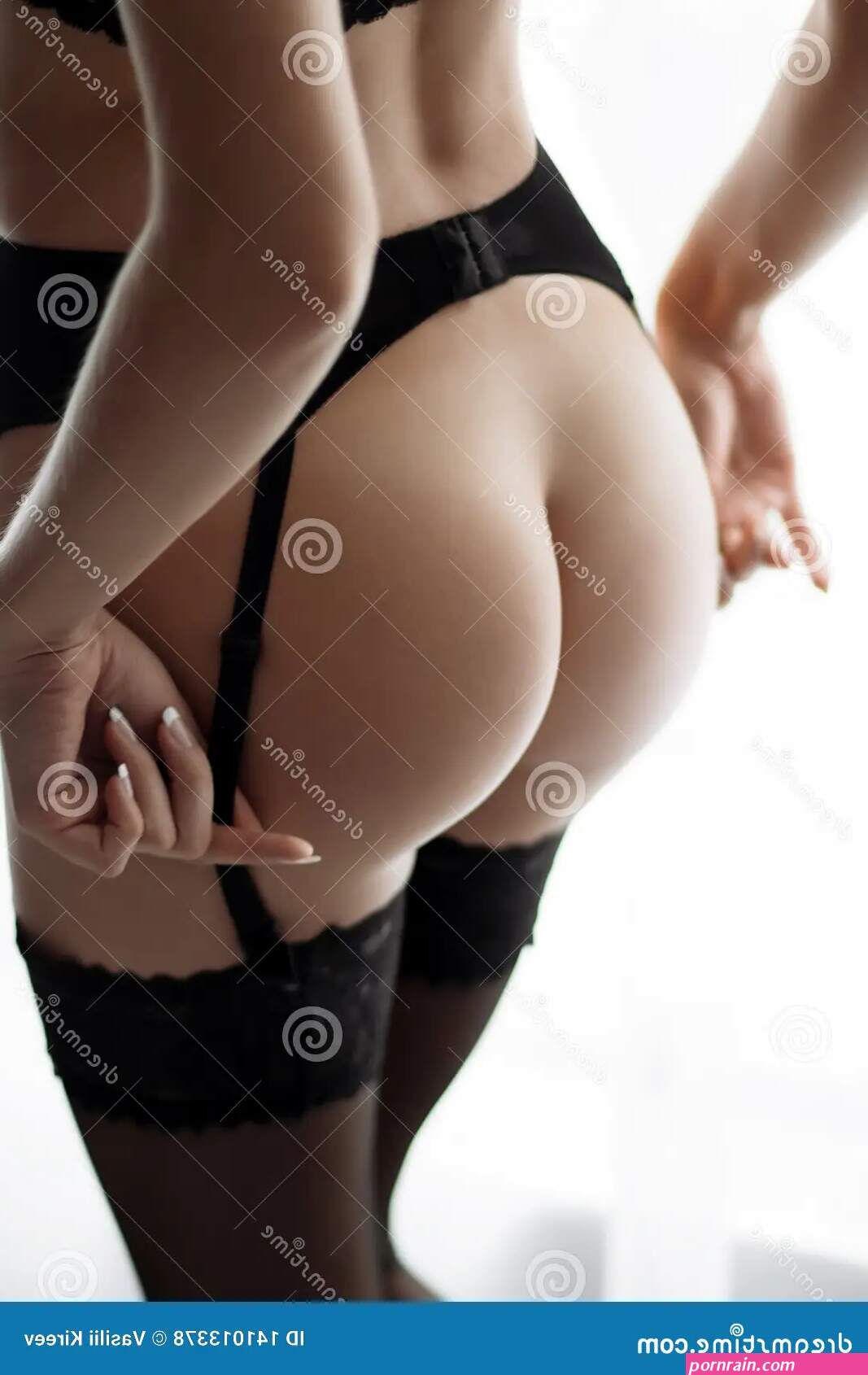 Girl with a Naked in a Corset Stock Photo