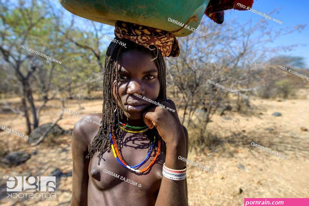 Young girl of the Mundimba tribe of Cunene in southern Angola Africa Stock Photo Picture And Rights Managed Image. Pic. NVI-10025176