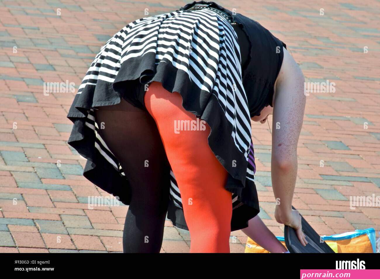 A woman bending over with her underwear showing Stock Photo