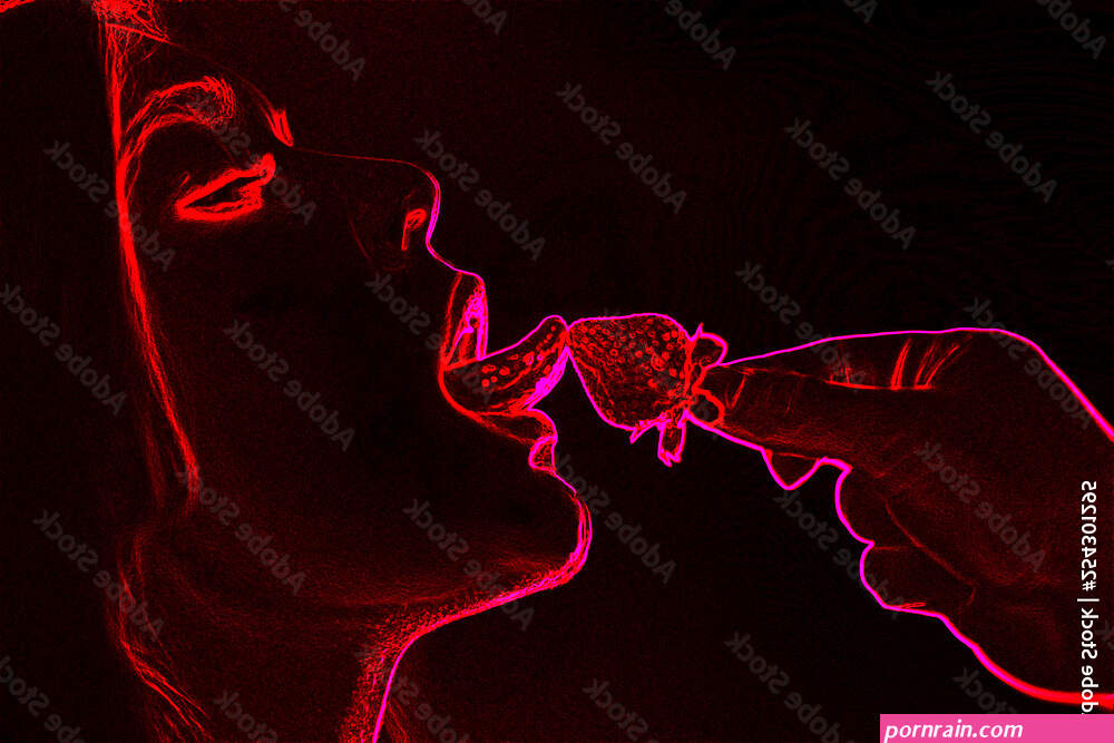 Sexual games silhouette between man and woman with strawberry neon light background Stock