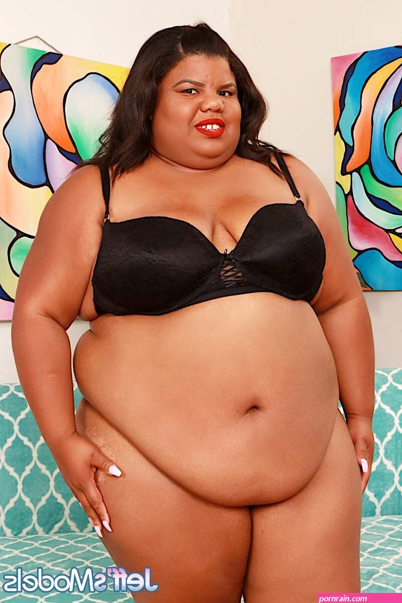 Ebony SSBBW Peaches Love gets bare naked before a finger fuck on a futon