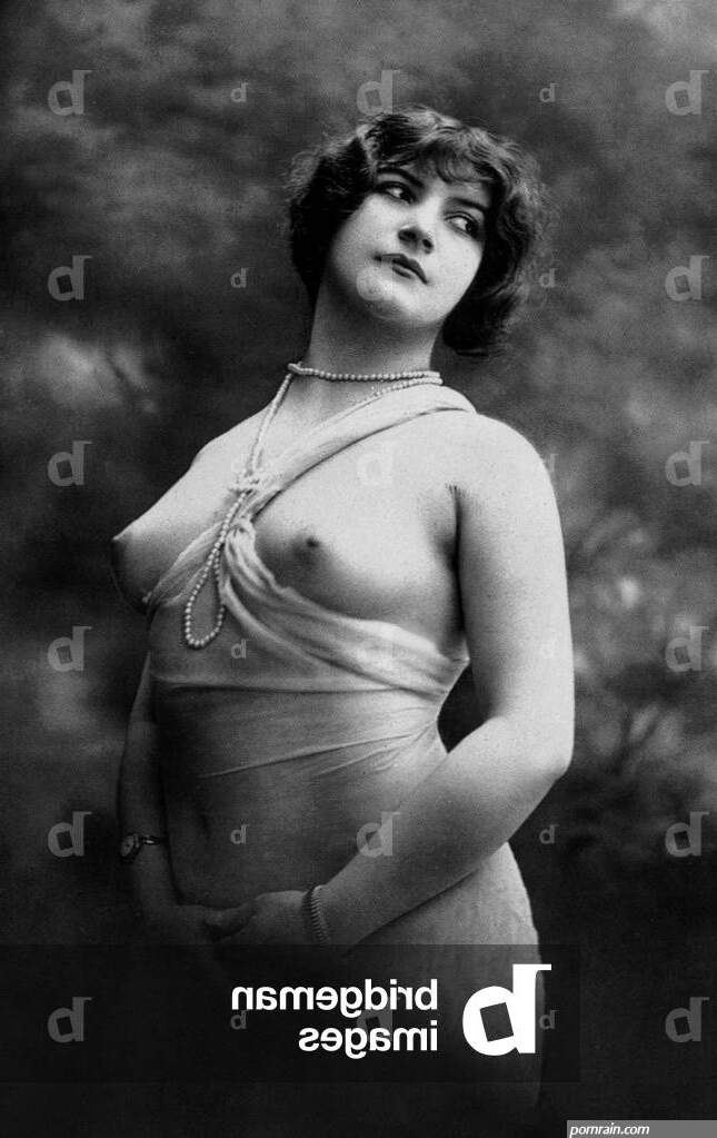 Image of Erotic photo of an half naked woman showing her breast
