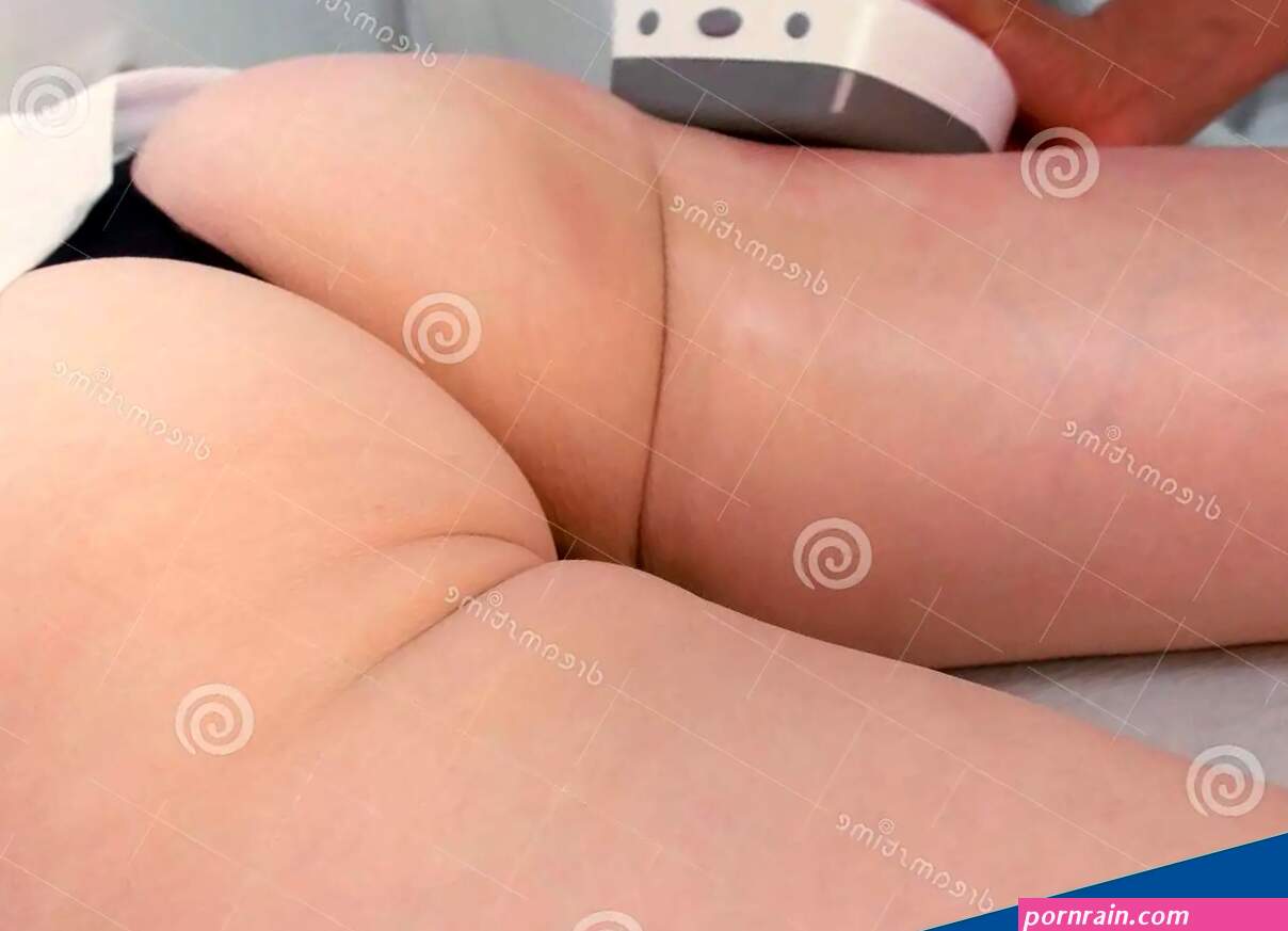 Cosmetologist Makes a Woman in Lpg Massage with Oil on the Booty and Hips. Booty and Hands Close-up. Stock Image