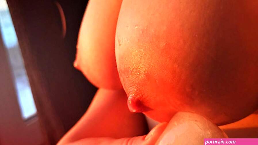 Beautiful erotica! Playing with my big titties nipples with an ice cube at sunset.