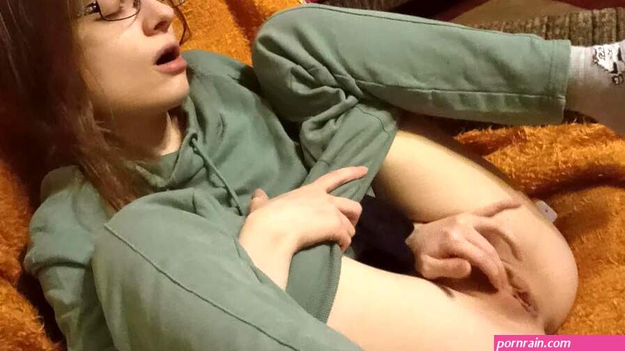 Cute teen girl masturbates while her parents are in the next room