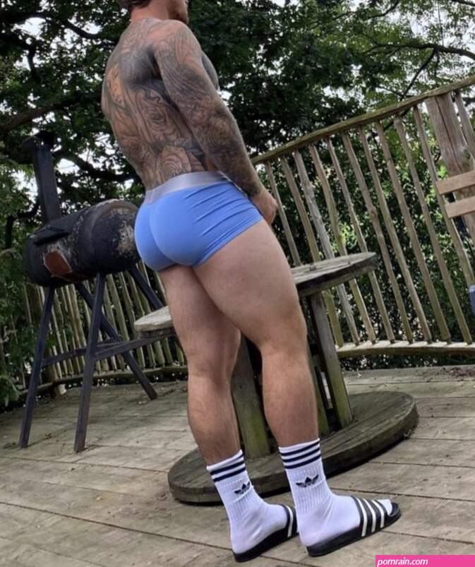 Tattooed Chris Hatton in white Adidas crew socks and slides