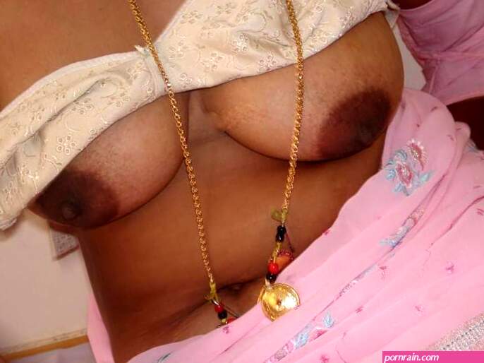 Hot Indian porn pics of Tamil aunty with big boobs stripped and fucked