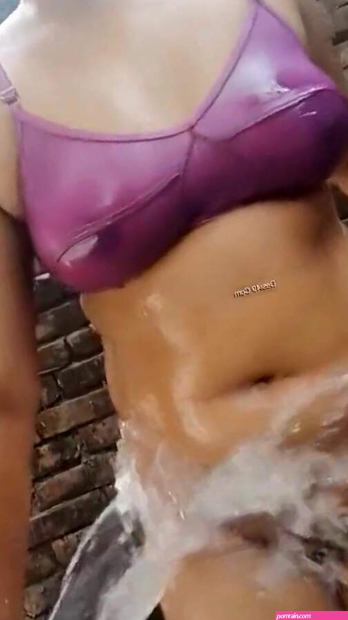 Beautiful Indian girl bathes naked in the open bathroom with a water pipe Indian Video