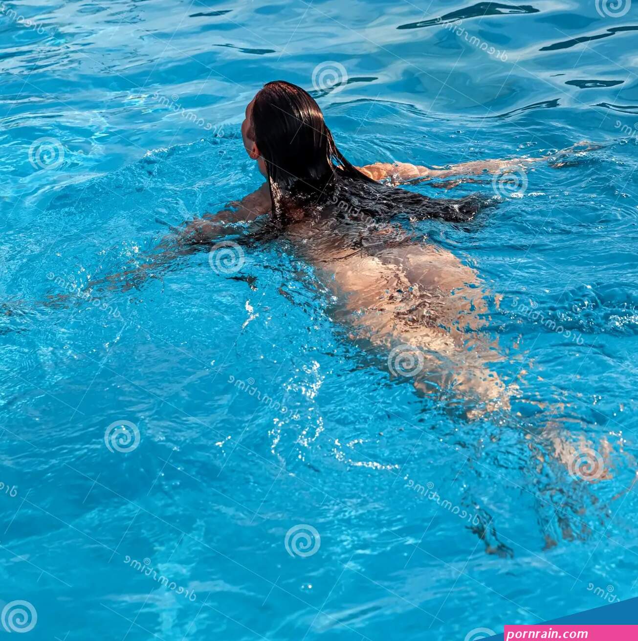 Young Nude Woman in the Outdoor Pool Stock Image