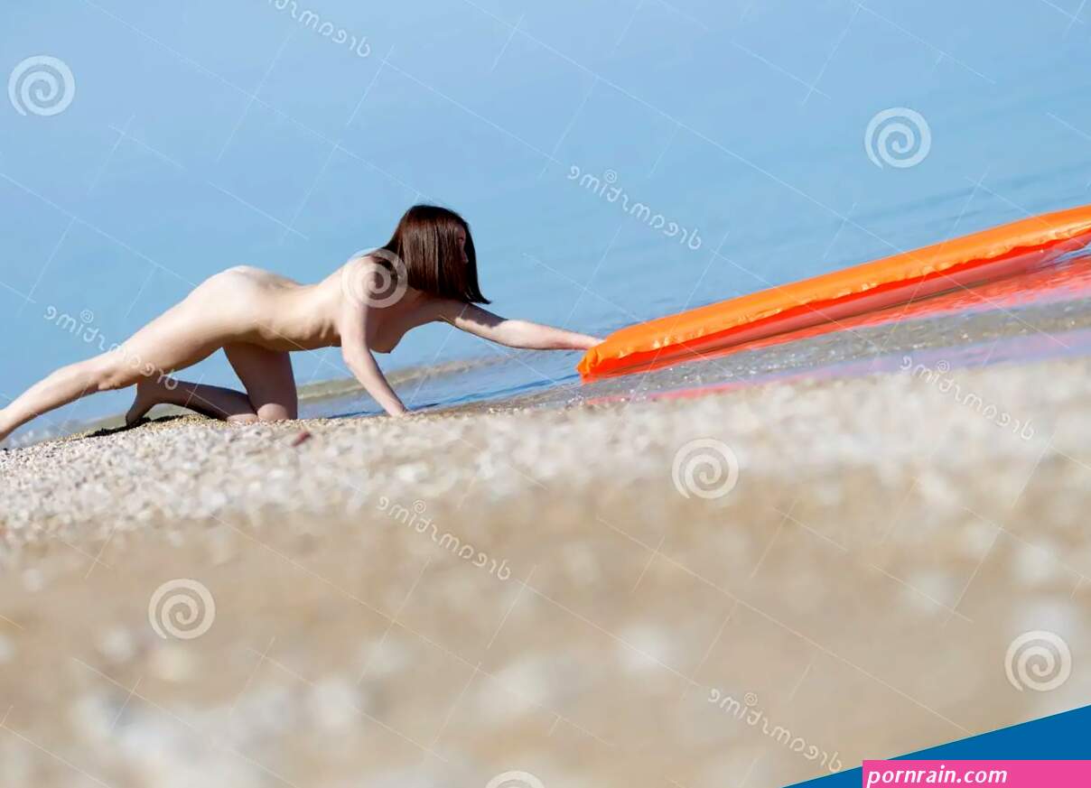 Naked Girl Out of the Sea a Pool Raft Stock Photo